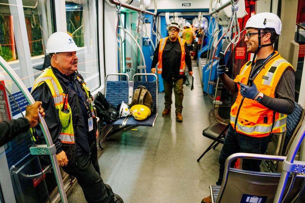I interview Operator Yann, with other testing employees visible in the background